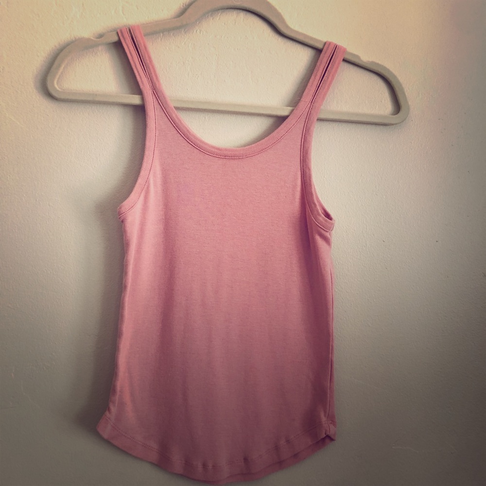 Pink tank top with split strap detail.